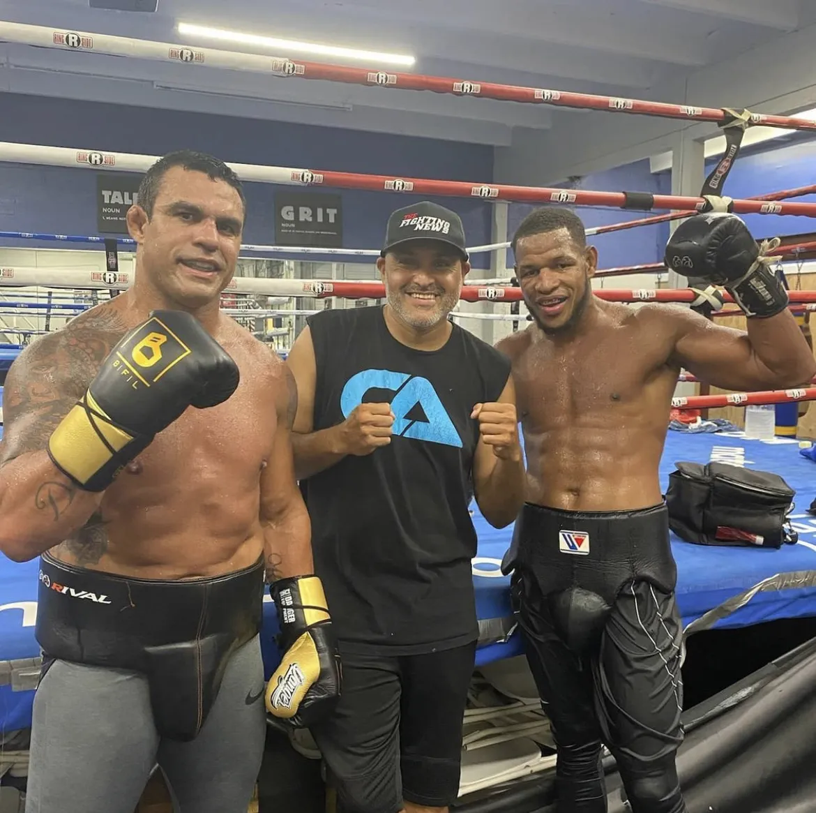 Derik Santos in the ring with Vitor Belfort and a pro fighter